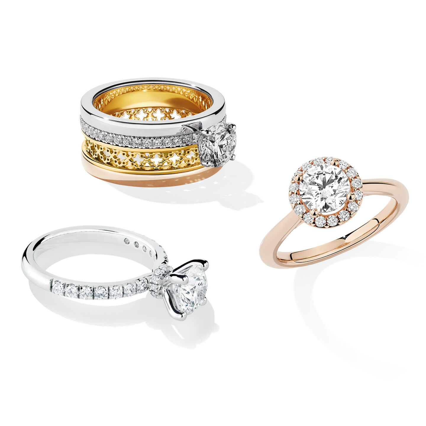 Three Birks diamond engagement rings on a white background.